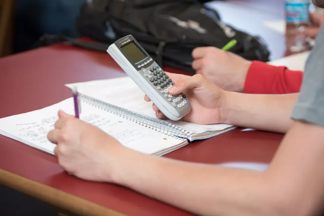 Accounting students doing calculations